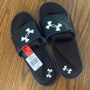 Never warn men’s size 12, black, Under Armour slides.